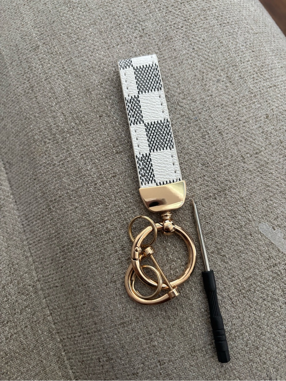 White Checker key fob with Gold Hardware